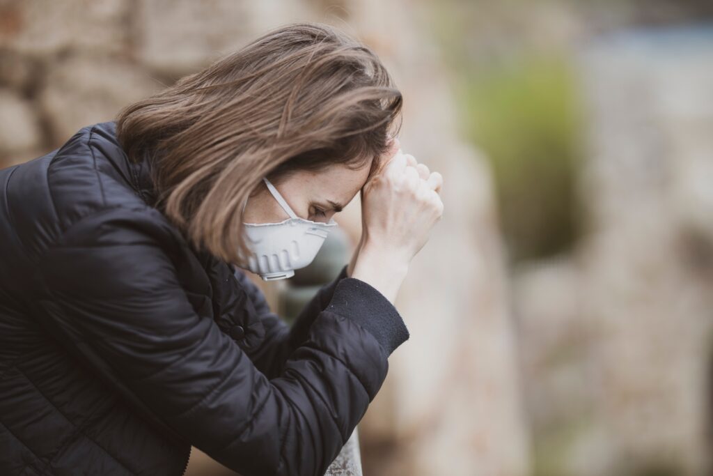Woman wearing face mask during coronavirus outbreak - Is A Stress-Free Life Possible?